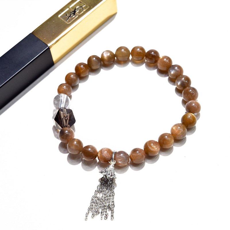 Golden Bone Crystal Bracelet with Tassel Design